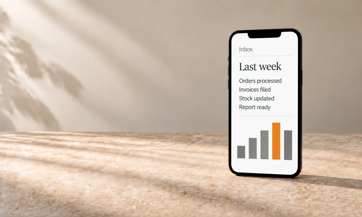 A phone on cream stone; an opened weekly summary in the inbox with four lines and, below them, a bar chart with one bar in orange.